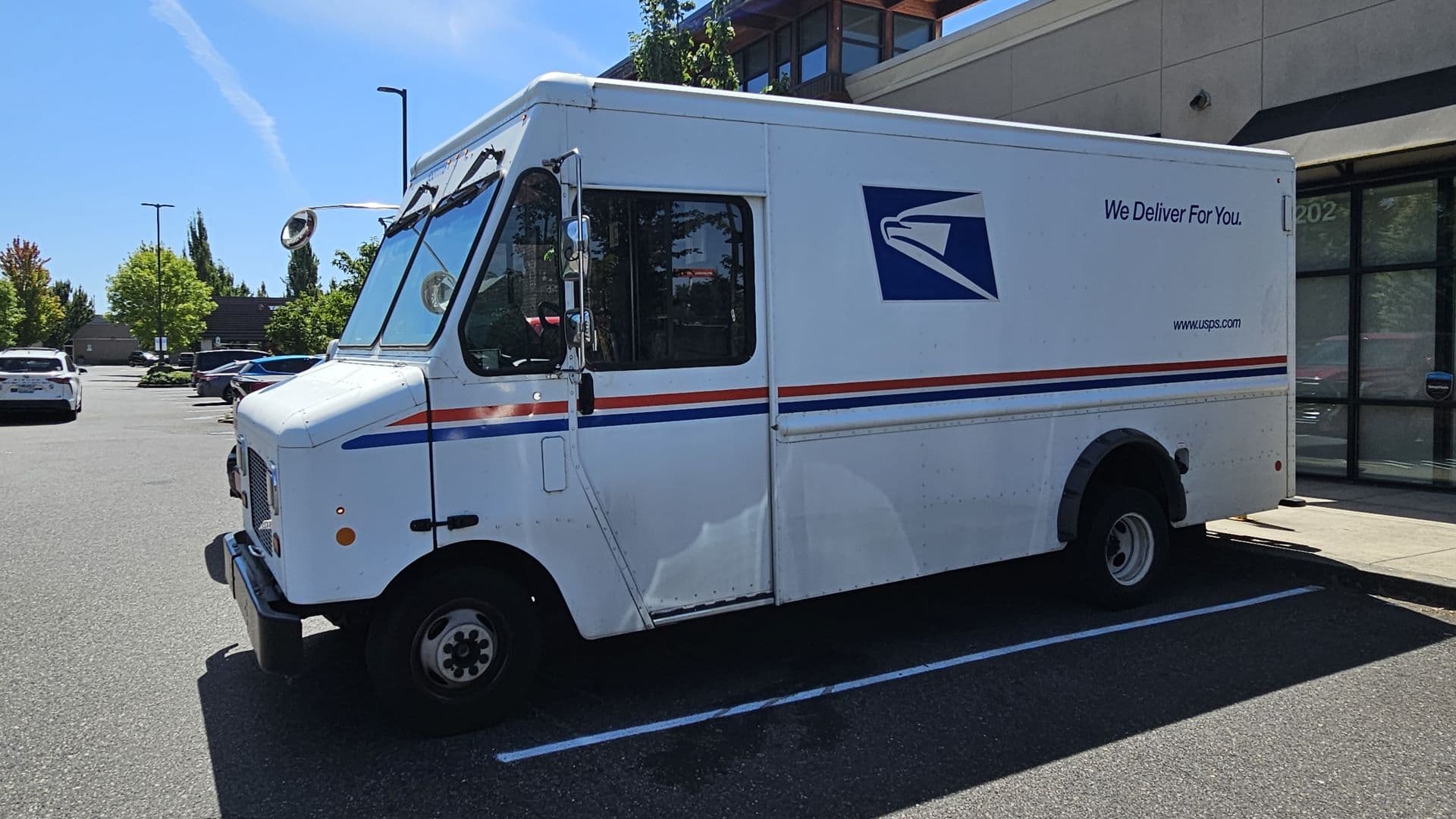 Troubled Postal Service moves to raise stamp prices, conserve cash
